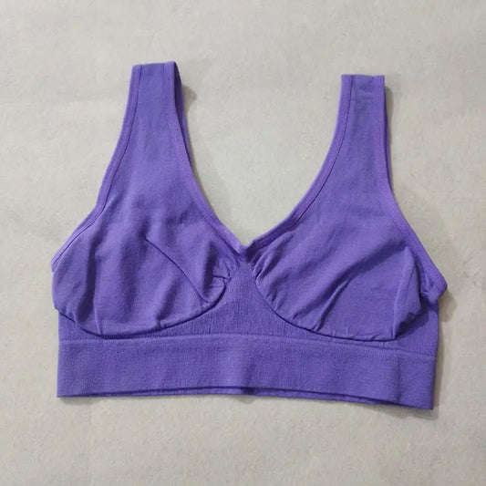 Purple wireless sports bra without padding, bralette-style with a wide elastic band and non-adjustable straps.