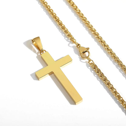 Gold-tone cross pendant necklace on a chunky chain with lobster clasp.