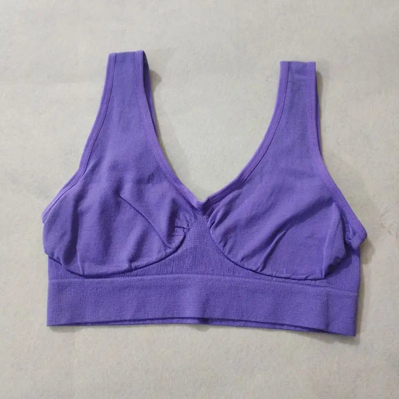 Purple wireless sports bra without padding, bralette-style with a wide elastic band and non-adjustable straps.