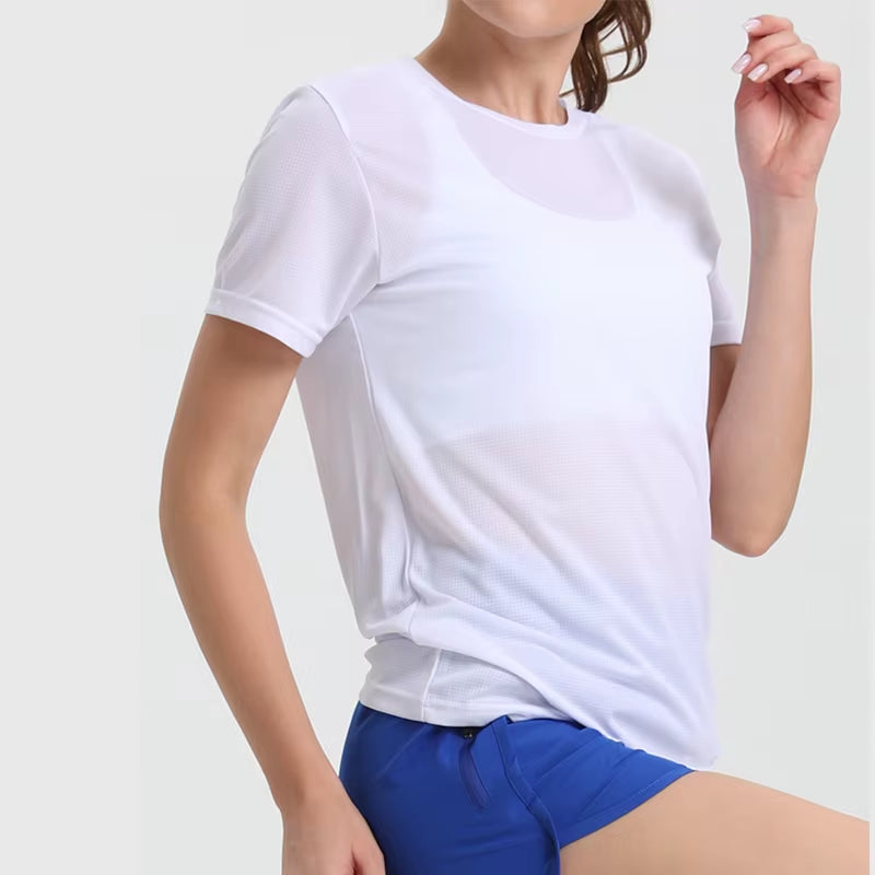 Woman wearing white ultralight quick-dry sport T-shirt and blue running shorts, breathable gym top.