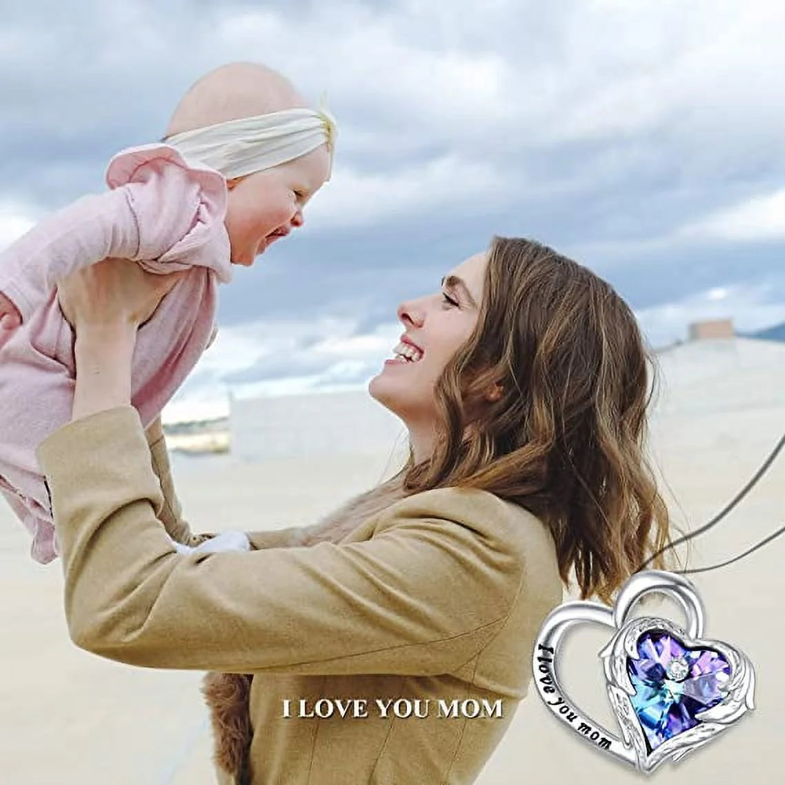 Mother and baby with a 925 Sterling Silver I Love You Mom heart necklace featuring Austrian crystals.