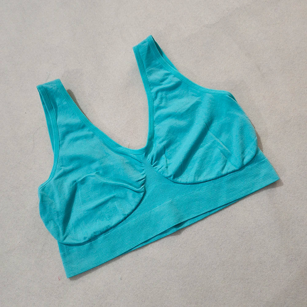 Teal wireless sports bra, unpadded with a wide band and non-adjustable straps.