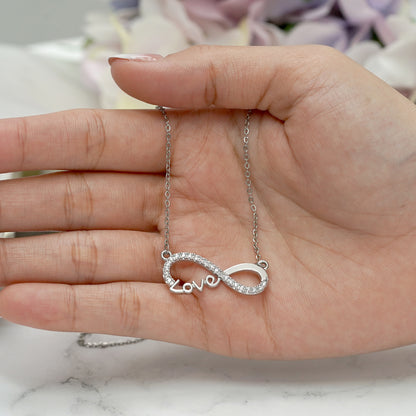Infinity Love pendant necklace with pavé stones on a silver chain.