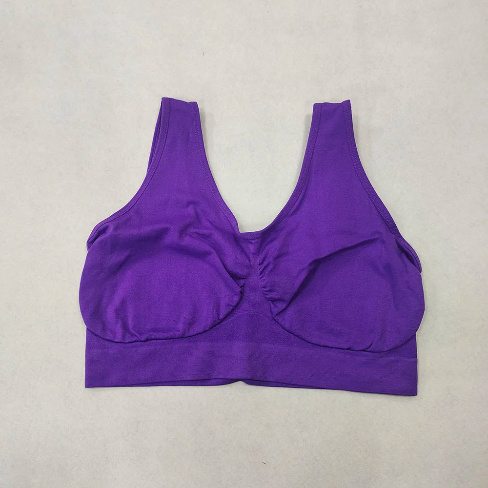 Purple wireless bralette-style sports bra with wide band, plus size, no padding, no pockets.